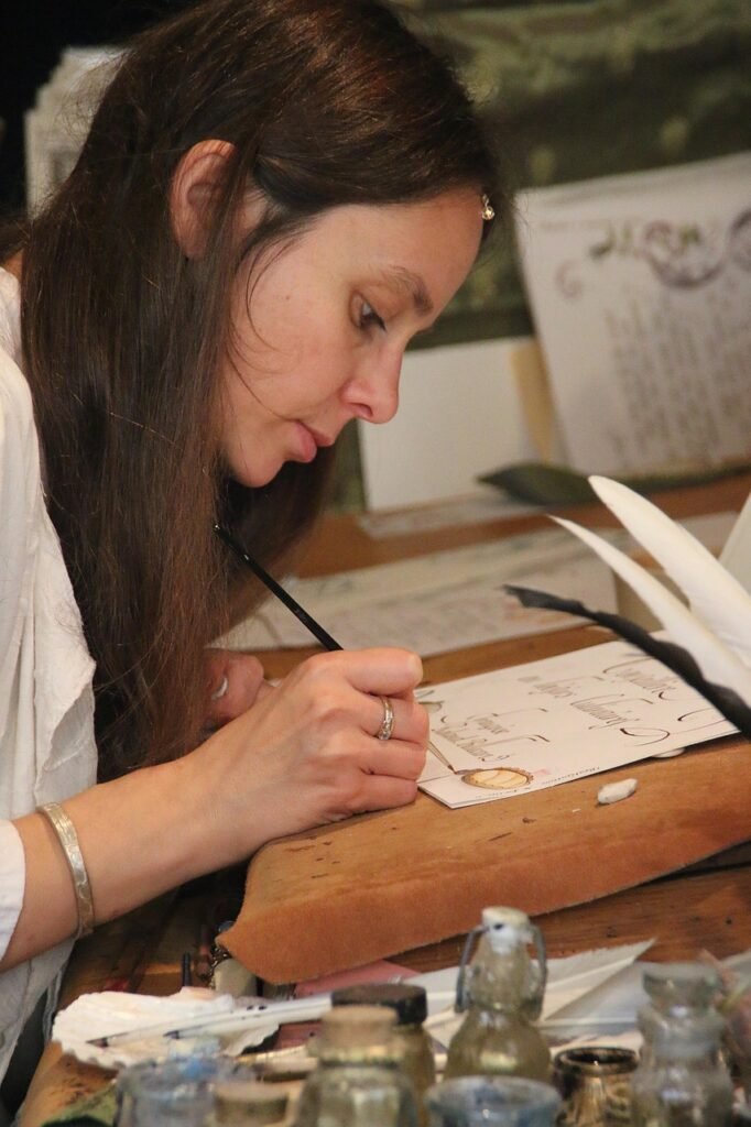 g8b4ba94d09a58bf374f9a0126b93f78140c71be0079d1a6cbf702bba0ceb6fa3cb7c7499da95515ad2e9c76567ea82d395a432361ae4c11b29e0042398c288db_1280-4086568 artist, woman, traditional, writing, calligraphy, female, portrait, girl, artistic, arts, painting, creative, young, paper, person, creativity, fantasy, lifestyle, writer, style, brown writing, brown creative, calligraphy, writer, writer, writer, writer, writer